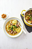 Tortellini stew with smoked pork and pesto