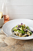 Pasta with asparagus, olives, pecorino and pepper
