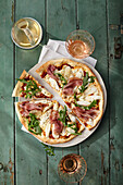 Asparagus and ham pizza with robiola and rocket salad