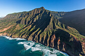 Ocean waves breaking on the Na Pali Cliffs, Hawaii, USA