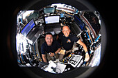 NASA astronauts Hines and Lindgren inside ISS cupola