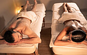 Couple massage at spa with peel procedure