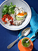 Hearty porridge with avocado dip and poached eggs