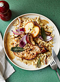Pork chops with apples, red onions, and spaetzle