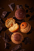 Assorted mini cream puffs with chocolate, coffee and caramel flavours