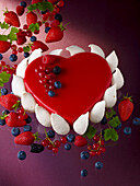 Heart-shaped cake with red berries