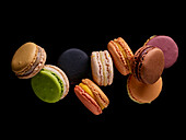 Colorful macarons on a black background