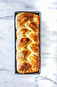 Braided Yeast bread in a baking tin