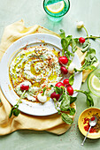 Whipped feta with oil, spices and radish