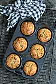 Food muffins with parmesan, basil and sun-dried tomatoes
