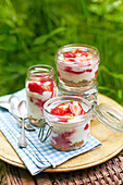 Cheesecake with strawberries in a glass jar
