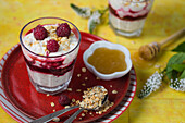 Fresh raspberries with whipped cream, honey, and toasted oats (cranachan)