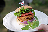 Hot chicken burger with basil dressing