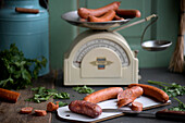 Cutting board with sausages and a knife