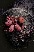 Raspberry-blackberry dessert with dried rosebuds