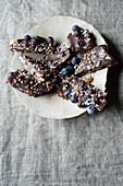 Vegan chocolate bar with blueberries and coconut flakes