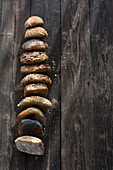 Many different grain rolls on a wooden background