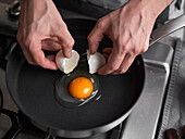 Fry an egg in a nonstick pan
