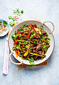 Asian beef salad with peppers and sesame seeds