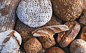 Different kinds of wholewheat loaves of bread (fills the picture)