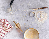 Baking scene with utensils and flour