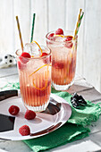 Non-alcoholic rhubarb tonic with raspberries for soccer game night