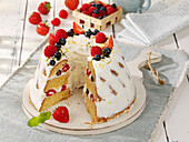 Creamy layered bundt cake with fresh berries