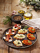 French bruschetta with camembert, tapenade, and goat cheese