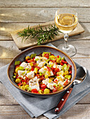 Portuguese stockfish with vegetables and olives