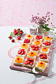 Coconut slices with strawberries and mango