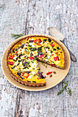 A gluten-free vegetable quiche made with sweet potato flour