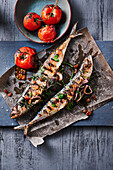Grilled mackerel stuffed with port wine onions served with tomatoes
