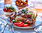 Souvlaki - Greek grill skewers with pita, cucumber, and tomato