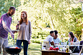Young people having a barbecue in the garden