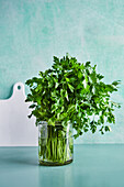 Fresh flat leaf parsley in a jar