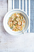 Linguine pasta in a creamy sauce with shrimp, parmesan cheese and parsley