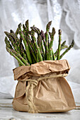 Fresh green asparagus in a paper bag