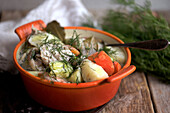 Fish stew with potatoes, carrots and dill