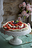 Summer berry flatbread on a cake stand