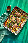 Tyme and emon chicken thighs tray bake with green beans, butternut squash and lemon