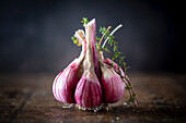 Garlic bulb and thyme sprigs