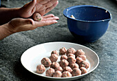 Prepare rosemary meatballs: ground meat mixture shaped into balls