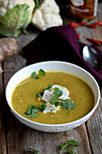 Cauliflower soup with Indian flavors, garnished with cilantro
