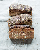 Three linseed bread loaves