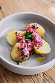 Young potatoes with beet cottage cheese