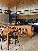 Open kitchen with kitchen island and dining area