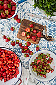 Preparing strawberry jam - clean and chop strawberries