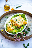 Puff pastry vegetable pockets with mozzarella and rocket salad