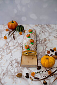 Autumnal nougat-vanilla roll decorated with a pumpkin