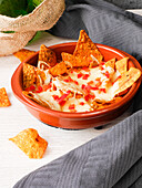 Pepper and cheese dip with nacho chips